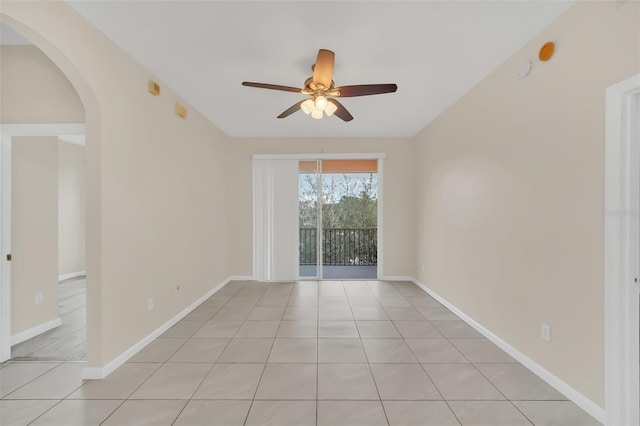 unfurnished room featuring ceiling fan and light tile patterned floors