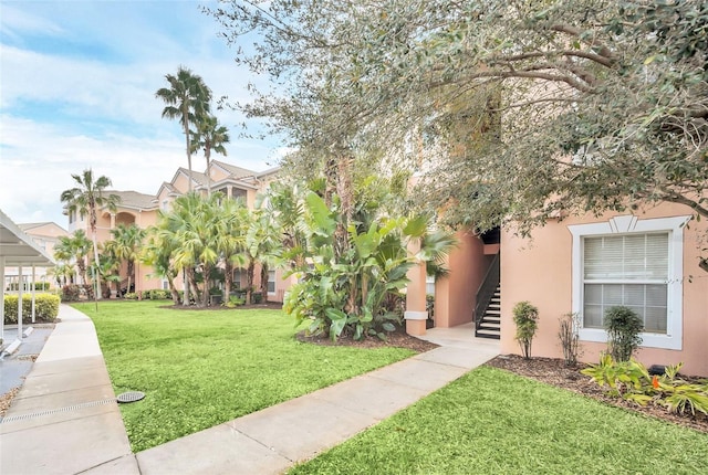 13500 Turtle Marsh Loop Unit 839, Orlando, FL 32837 - view of home's community featuring a lawn and stairway