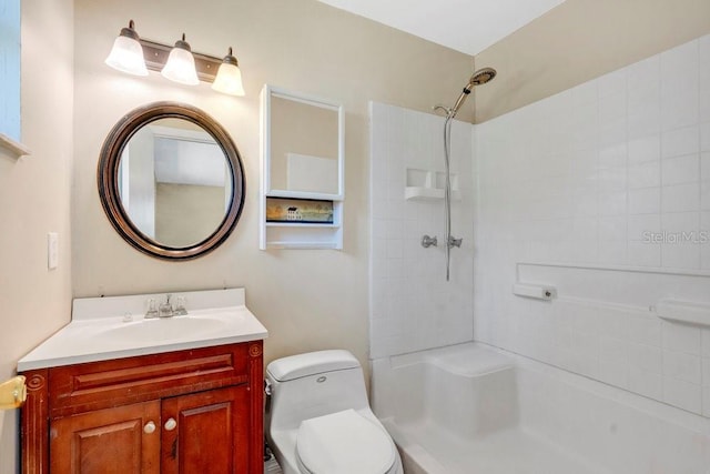 full bathroom with toilet, vanity, and walk in shower