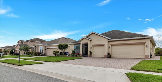 ranch-style home with a garage and a front yard