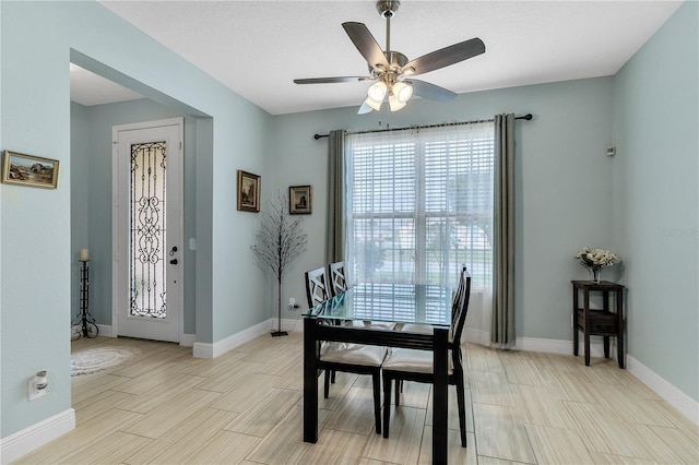 dining space with ceiling fan