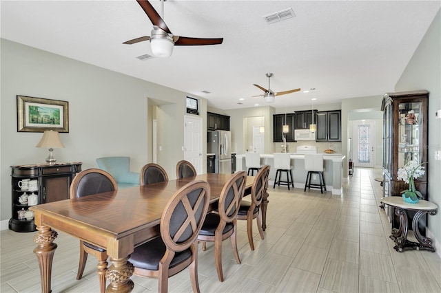 dining space with ceiling fan