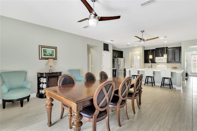 dining area featuring ceiling fan