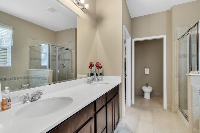 bathroom featuring walk in shower, a bidet, and vanity