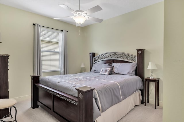 bedroom featuring light colored carpet and ceiling fan