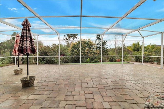 view of patio / terrace featuring glass enclosure