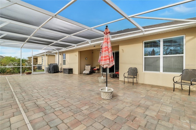 view of patio / terrace with a lanai