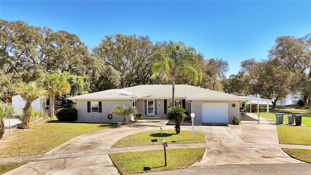 ranch-style house with stucco siding, an attached garage, fence, concrete driveway, and a front yard