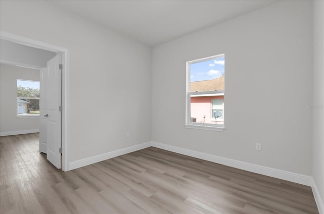 spare room with light wood-type flooring