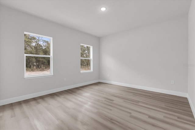 unfurnished room featuring light hardwood / wood-style floors