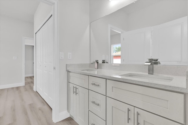 bathroom featuring vanity and hardwood / wood-style flooring