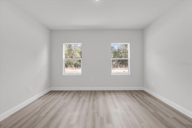 empty room with light wood-type flooring