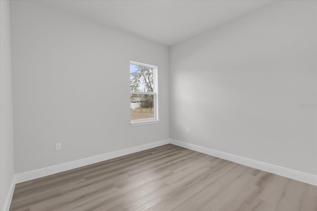 spare room featuring light hardwood / wood-style floors