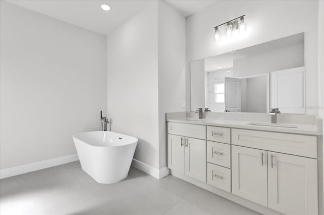 bathroom featuring vanity and a tub