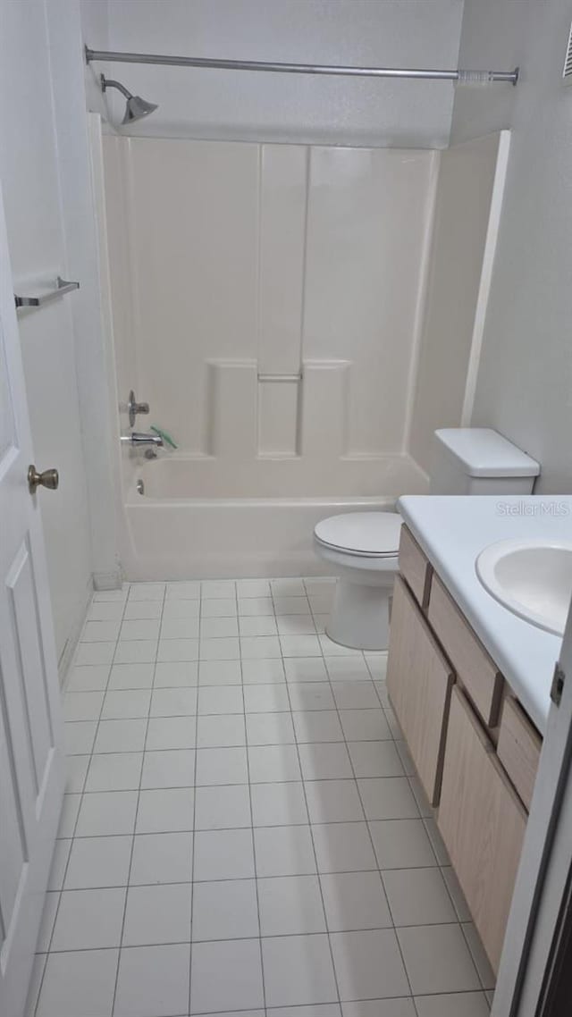 full bathroom with tile patterned floors, vanity, toilet, and shower / bath combination