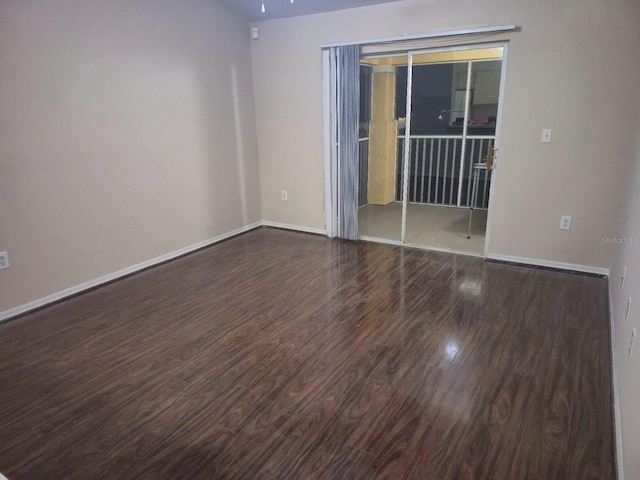 empty room featuring dark wood-type flooring