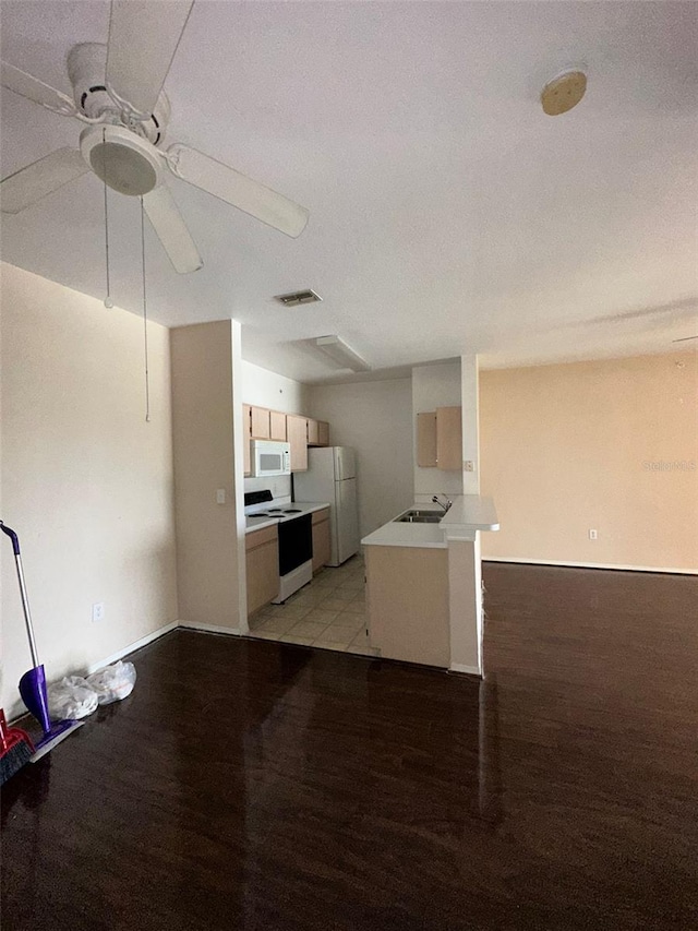 kitchen with sink, white appliances, light hardwood / wood-style flooring, and ceiling fan