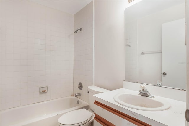 full bathroom with vanity, toilet, and tiled shower / bath