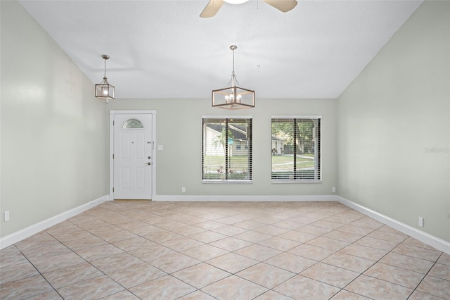 interior space with ceiling fan with notable chandelier and vaulted ceiling