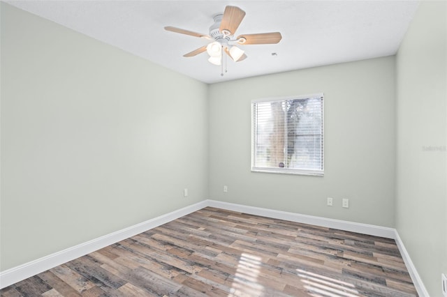 unfurnished room with wood-type flooring and ceiling fan