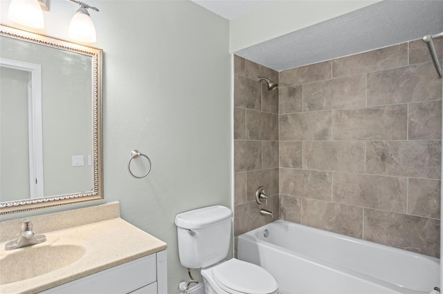 full bathroom with tiled shower / bath combo, vanity, and toilet