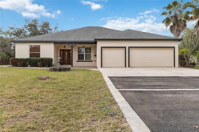 view of front of property featuring a garage and a front yard