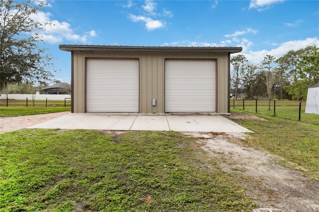 garage with a yard