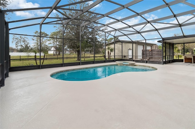 view of swimming pool featuring a lanai, a patio, and an in ground hot tub