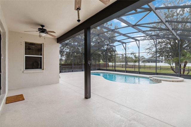 view of swimming pool featuring a lanai, a patio area, ceiling fan, and an in ground hot tub