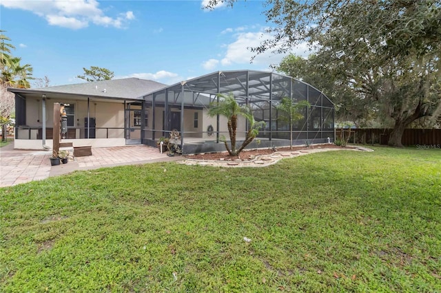 view of yard featuring a lanai and a patio area