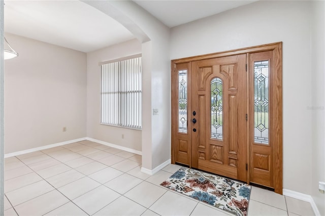 foyer featuring light tile patterned floors