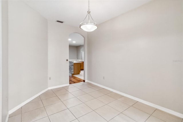 unfurnished dining area with light tile patterned floors