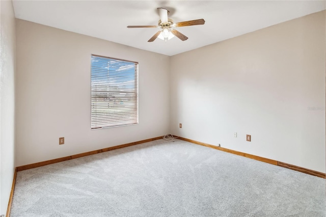 empty room featuring carpet flooring and ceiling fan