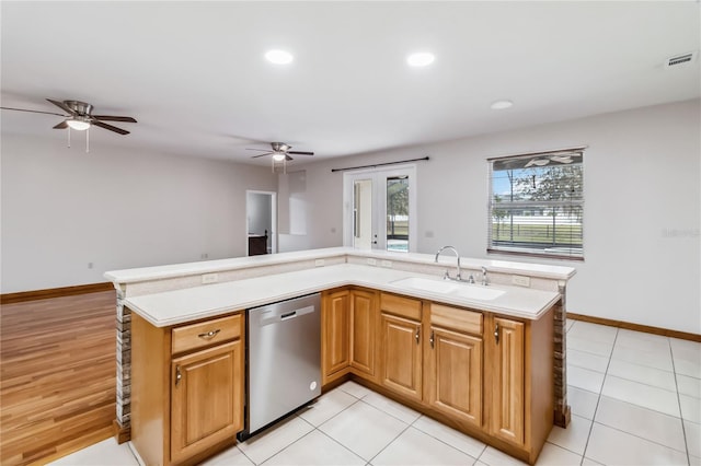 kitchen with sink, light tile patterned floors, dishwasher, and ceiling fan