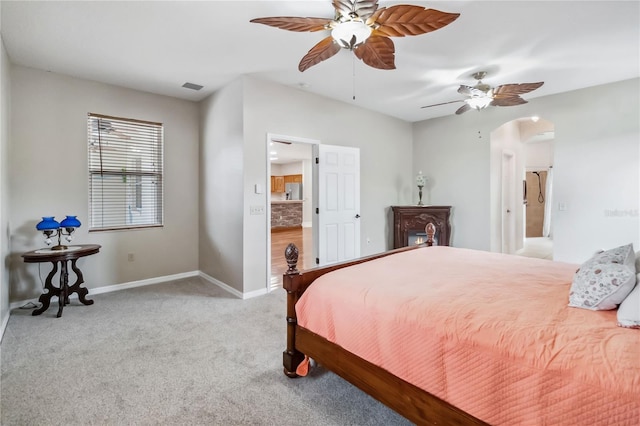 bedroom featuring light colored carpet and ceiling fan