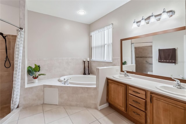 bathroom featuring vanity, tile patterned floors, and plus walk in shower