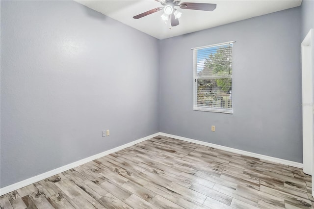 empty room featuring ceiling fan and light hardwood / wood-style floors