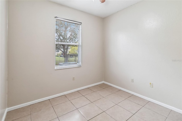 unfurnished room with light tile patterned floors