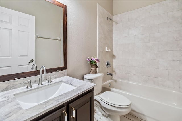 full bathroom featuring vanity, toilet, and tiled shower / bath