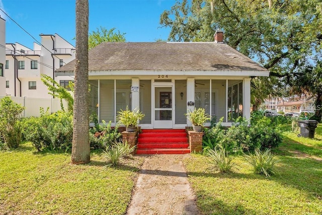 bungalow-style house with a front yard