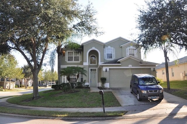 913 Henley Cir, Davenport, FL 33896 - front of property with a garage and a front yard