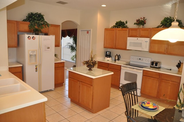 913 Henley Cir, Davenport, FL 33896 - kitchen with sink, light tile patterned floors, white appliances, and a center island