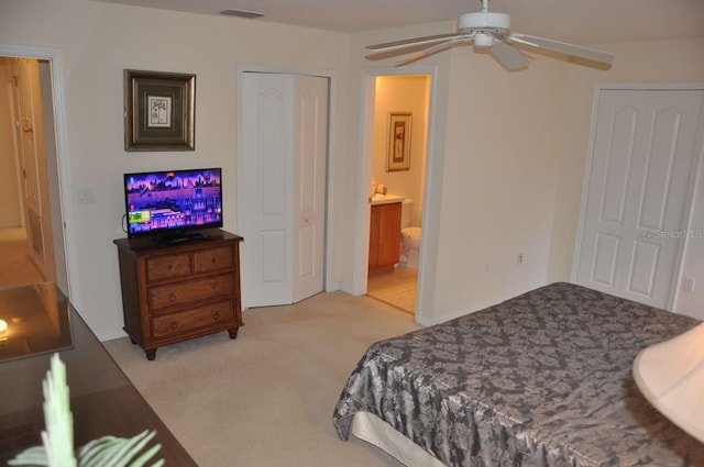 913 Henley Cir, Davenport, FL 33896 - bedroom with light carpet and connected bathroom