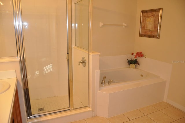 913 Henley Cir, Davenport, FL 33896 - bathroom with tile patterned floors, independent shower and bath, and vanity