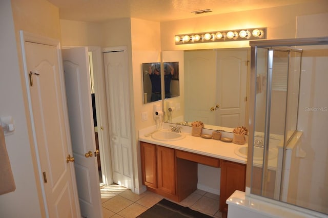 913 Henley Cir, Davenport, FL 33896 - bathroom with tile patterned flooring, vanity, and walk in shower