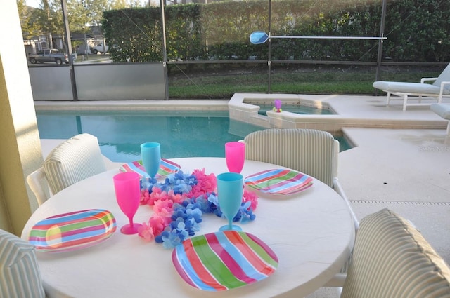 913 Henley Cir, Davenport, FL 33896 - view of swimming pool featuring a patio area, glass enclosure, and an in ground hot tub