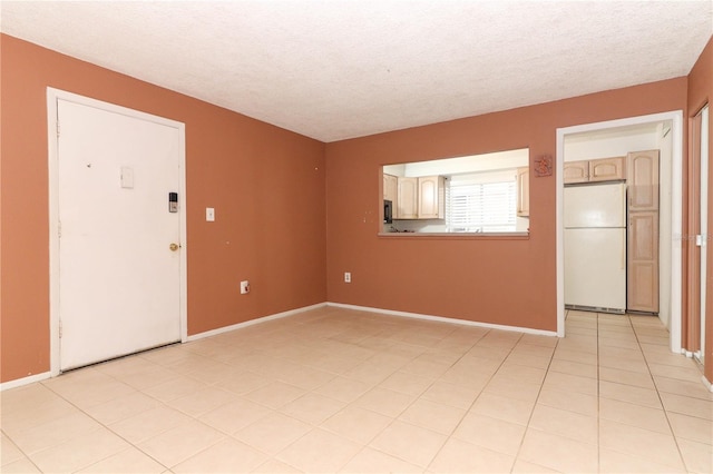 626 Orange Dr Unit 242, Altamonte Springs, FL 32701 - tiled spare room featuring a textured ceiling