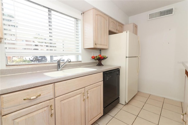 626 Orange Dr Unit 242, Altamonte Springs, FL 32701 - kitchen with light tile patterned flooring, sink, black dishwasher, and light brown cabinets