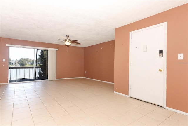 626 Orange Dr Unit 242, Altamonte Springs, FL 32701 - spare room with a textured ceiling, ceiling fan, and light tile patterned flooring