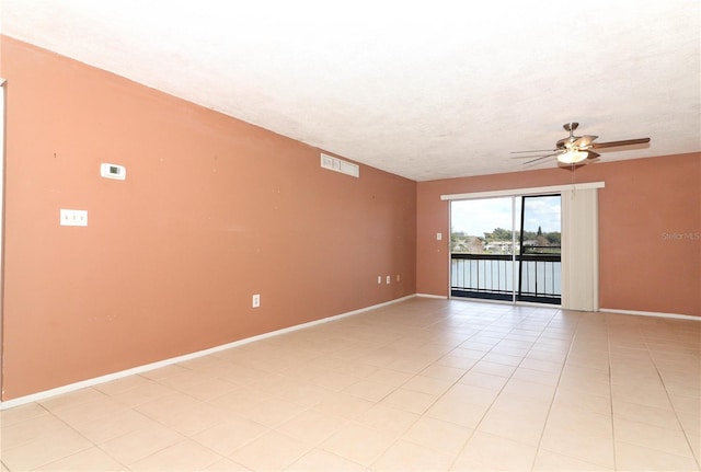 626 Orange Dr Unit 242, Altamonte Springs, FL 32701 - spare room featuring light tile patterned floors, a textured ceiling, and ceiling fan
